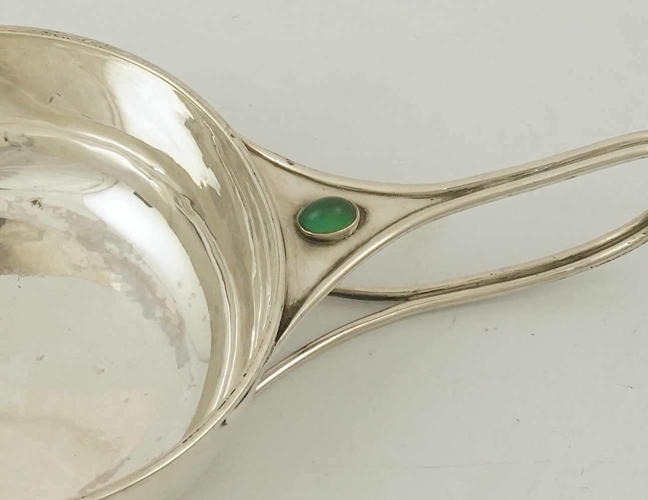 An Edwardian Arts & Crafts Charles Robert Ashbee for the Guild of Handicrafts Ltd silver and single stone cabochon chrysoprase set porringer